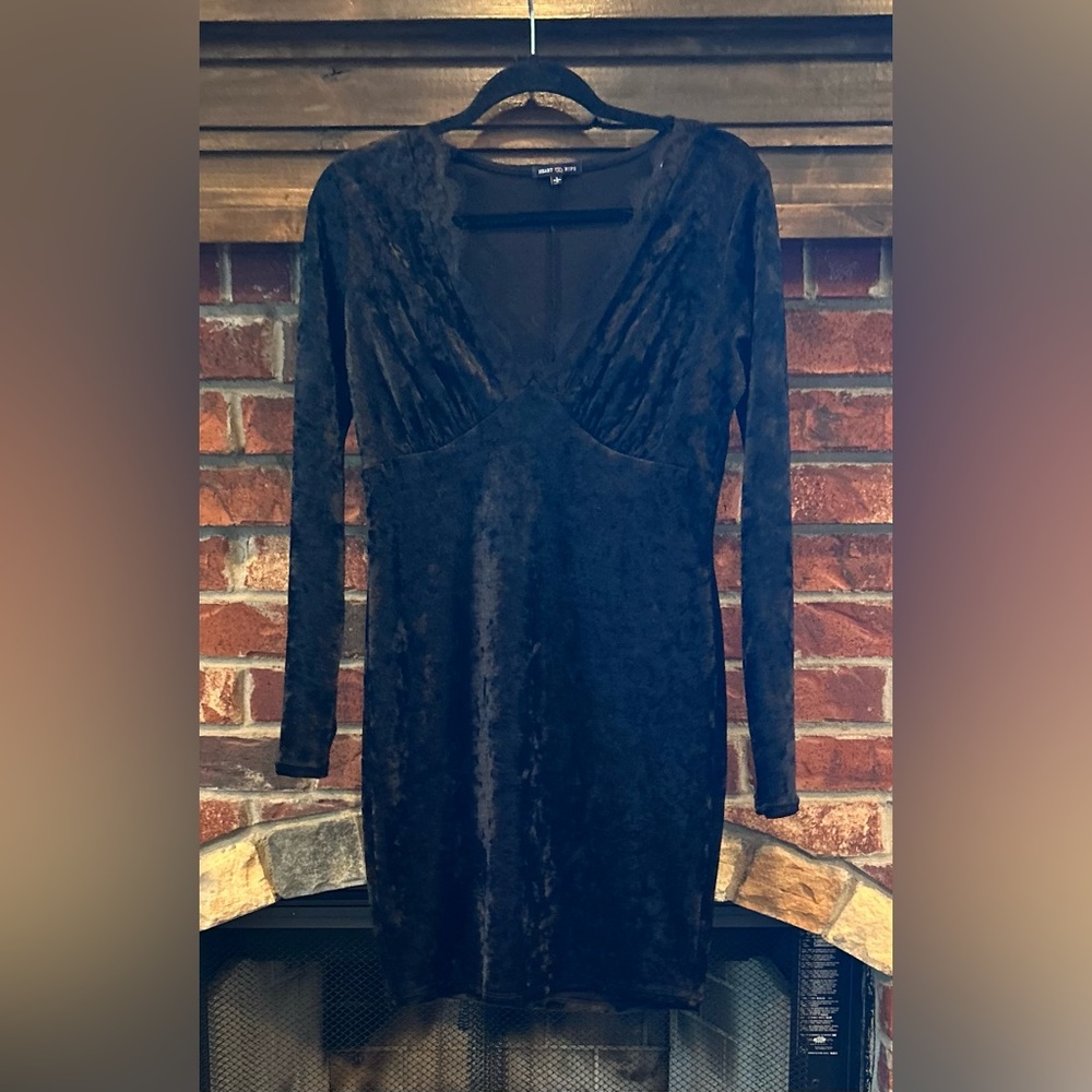 Black velvet body con with plunging neckline.  Perfect for date night